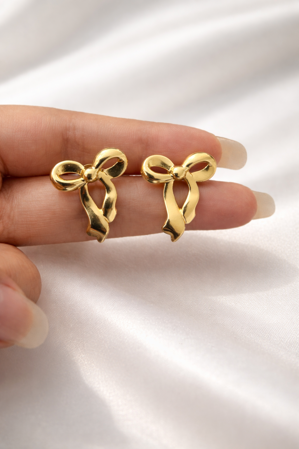 2503febe-a61c-4b0f-a295-205bf67c34fa.png Bow Anti Tarnish Earrings - Image 1