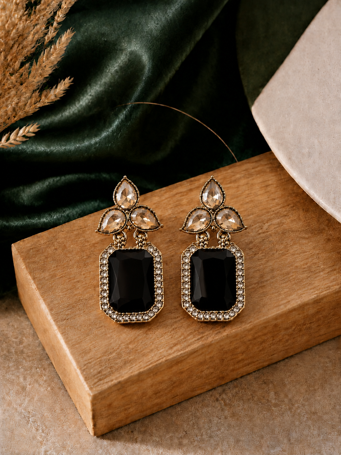 Jet-Black-Earrings-on-Green-Silk.png Aarini Black Kundan Stud Earrings - Image 1